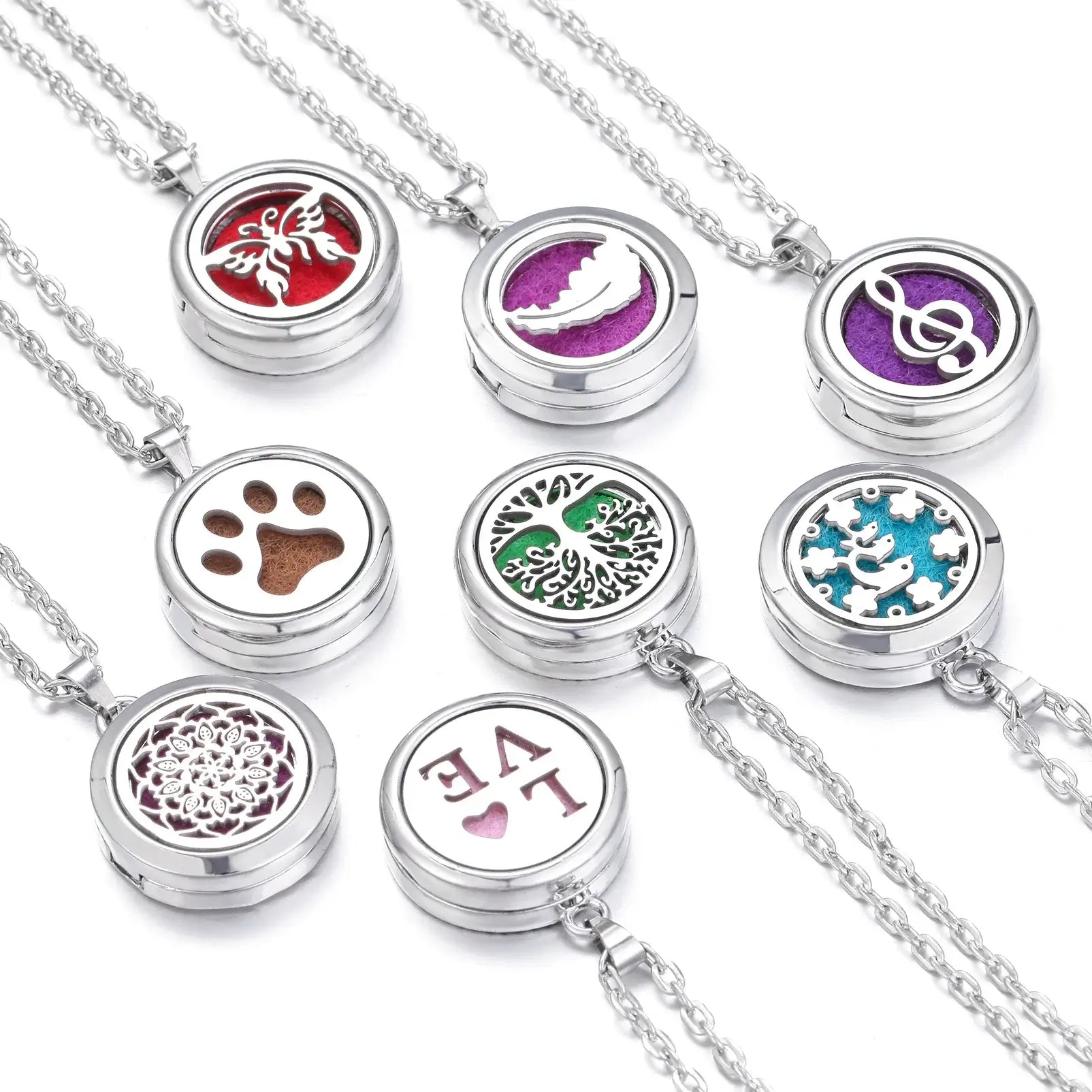 Collares difusores de aromaterapia en acero inoxidable con diseños vibrantes y coloridos.
