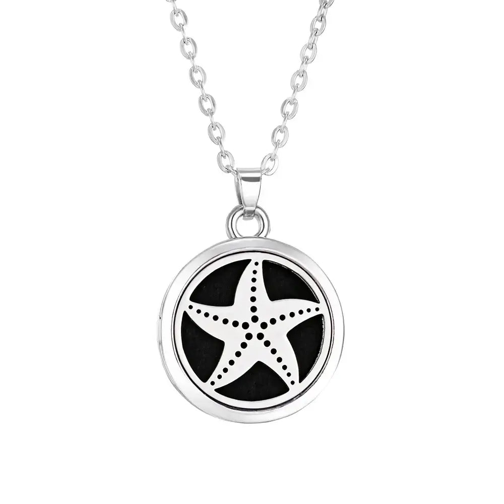 Collar difusor de aromaterapia en acero inoxidable con diseño de estrella de mar, ideal para aceites esenciales.