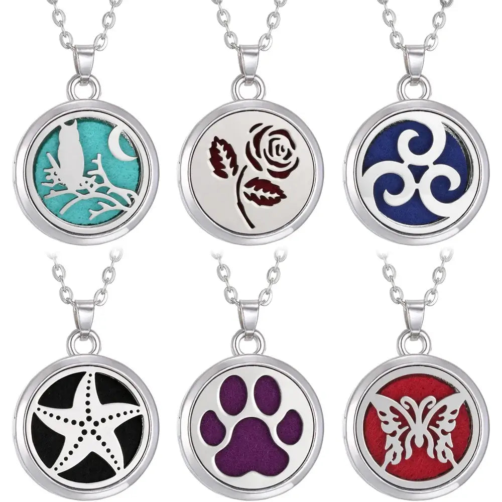 Collar difusor de aromaterapia en acero inoxidable con diseños variados y coloridos, ideal como regalo.