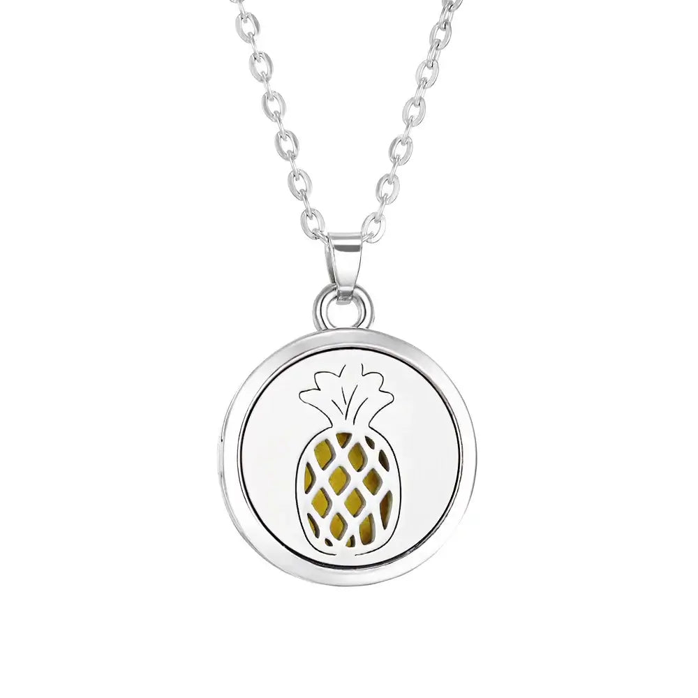 Collar difusor de aromaterapia de acero inoxidable con diseño de piña, elegante y portátil.